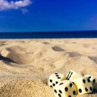 five-dice-on-sand-998679-scaled